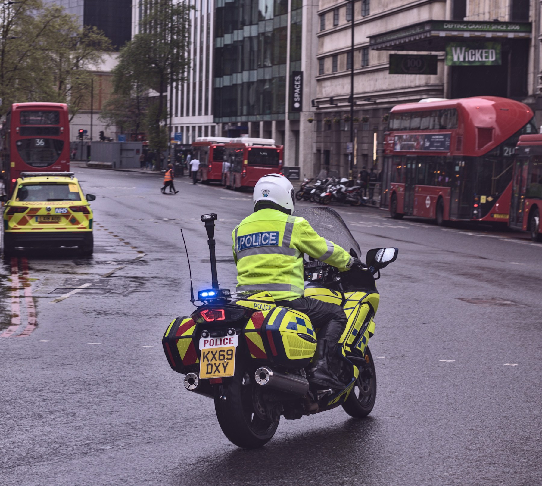 UK police officer and police vehicles representing law enforcement transcription services